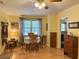 Charming dining area with natural light, table for six and classic decor at 712 Honeysuckle Ln, Temple, GA 30179