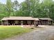 Inviting home with a covered porch and decorative accents, creating a warm and welcoming atmosphere at 712 Honeysuckle Ln, Temple, GA 30179