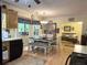 Charming kitchen featuring an eating area with natural light and access to the adjacent living area at 712 Honeysuckle Ln, Temple, GA 30179