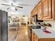 Spacious kitchen with light wood cabinets and stainless steel appliances opens to an eat-in dining area at 712 Honeysuckle Ln, Temple, GA 30179