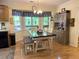 Inviting breakfast nook featuring a modern table set, ample natural light, and charming decor at 712 Honeysuckle Ln, Temple, GA 30179