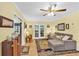 Cozy living room with neutral tones, comfortable seating, and access to an outdoor deck at 712 Honeysuckle Ln, Temple, GA 30179