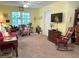 Inviting living room with bright light, comfortable seating, and carpeted floors at 712 Honeysuckle Ln, Temple, GA 30179