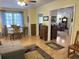 Inviting living room with dining area view and hardwood floors, offering a seamless flow throughout the home at 712 Honeysuckle Ln, Temple, GA 30179