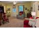 Inviting living room with cozy seating, plush carpet, and a bright yellow color scheme at 712 Honeysuckle Ln, Temple, GA 30179