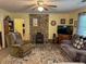 Cozy living room featuring a stone fireplace, creating a warm and inviting space at 712 Honeysuckle Ln, Temple, GA 30179