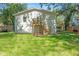 Expansive backyard featuring a wooden deck and walkout basement entrance at 1363 Diamond Se Ave, Atlanta, GA 30316