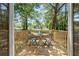 Outdoor balcony area with seating, surrounded by lush greenery and trees at 1363 Diamond Se Ave, Atlanta, GA 30316