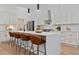 Modern kitchen featuring stainless steel appliances, white cabinets, quartz countertops, and a center island with seating at 1363 Diamond Se Ave, Atlanta, GA 30316