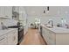 Spacious kitchen featuring stainless steel appliances, quartz countertops, and a center island at 1363 Diamond Se Ave, Atlanta, GA 30316