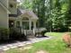 Back Entrance includes a covered deck area with stone pathway in a serene, wooded setting at 4673 Jefferson Township Pl, Marietta, GA 30066
