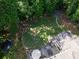 Large backyard with fire pit and trampoline surrounded by lush greenery at 4673 Jefferson Township Pl, Marietta, GA 30066