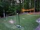 Large backyard featuring a soccer net, string lights, seating and a fire pit at 4673 Jefferson Township Pl, Marietta, GA 30066