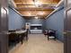 Unfinished basement features exposed ceiling, concrete floor, and space for recreation with a game table and bunk bed at 4673 Jefferson Township Pl, Marietta, GA 30066