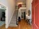 Inviting foyer with hardwood floors, staircase, and elegant decor creating a warm ambiance at 4673 Jefferson Township Pl, Marietta, GA 30066