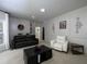 Bright living room featuring neutral walls and decor, recessed lighting, and comfortable seating at 4673 Jefferson Township Pl, Marietta, GA 30066
