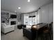 Open living room featuring built-in bookshelves, fireplace, and access to the outdoor deck at 4673 Jefferson Township Pl, Marietta, GA 30066