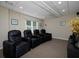 Cozy media room featuring comfortable seating, recessed lighting, and home theater setup at 4673 Jefferson Township Pl, Marietta, GA 30066