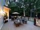 View of the patio featuring a dining table, an umbrella, chairs, and a ceiling fan at 4673 Jefferson Township Pl, Marietta, GA 30066