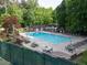 Relaxing community pool area with seating, umbrellas, and a refreshing swimming pool at 4673 Jefferson Township Pl, Marietta, GA 30066