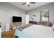 A bedroom with view of an ensuite bathroom and living area through separate doorways at 5300 Peachtree Rd # 105, Atlanta, GA 30341
