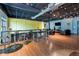 Bright common area featuring hardwood floors, counter seating, comfortable lounge chairs, and stylish lighting at 5300 Peachtree Rd # 105, Atlanta, GA 30341