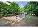 Courtyard with green space and seating for residents to relax and enjoy the outdoors at 5300 Peachtree Rd # 105, Atlanta, GA 30341