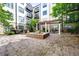 Building courtyard with a fountain and outdoor seating at 5300 Peachtree Rd # 105, Atlanta, GA 30341