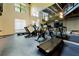 Well-equipped gym featuring treadmills, elliptical machines, and floor to ceiling mirror at 5300 Peachtree Rd # 105, Atlanta, GA 30341