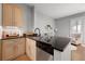 Modern kitchen with stainless steel appliances, granite countertops, and eat-in bar area at 5300 Peachtree Rd # 105, Atlanta, GA 30341