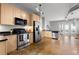 A modern kitchen features stainless steel appliances and beautiful light wood cabinetry at 5300 Peachtree Rd # 105, Atlanta, GA 30341