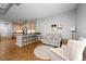 Open-concept living area with kitchen bar, perfect for entertaining and relaxation at 5300 Peachtree Rd # 105, Atlanta, GA 30341