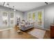 Inviting living room featuring multiple windows and doors, offering scenic views and easy outdoor access at 5300 Peachtree Rd # 105, Atlanta, GA 30341