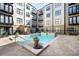 Relaxing community pool area featuring clear water, tiled accents, and comfortable lounge chairs at 5300 Peachtree Rd # 105, Atlanta, GA 30341