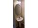 Bathroom featuring a pedestal sink, mirror, and modern light fixture at 7055 Blairs View Dr # 1, Austell, GA 30168