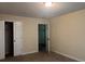 Carpeted bedroom featuring neutral walls and closet space; ready to be personalized at 7055 Blairs View Dr # 1, Austell, GA 30168