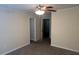 Neutral bedroom featuring carpet, a ceiling fan and two open doorways at 7055 Blairs View Dr # 1, Austell, GA 30168
