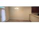 View of dining area with carpet, a modern light fixture, and access to the backyard at 7055 Blairs View Dr # 1, Austell, GA 30168