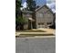Charming two-story brick home featuring a well-manicured lawn and attached garage at 7055 Blairs View Dr # 1, Austell, GA 30168