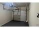 Empty garage featuring a dark floor and a white garage door at 7055 Blairs View Dr # 1, Austell, GA 30168