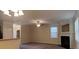 Open-concept living room featuring carpet, a fireplace, and windows with natural light at 7055 Blairs View Dr # 1, Austell, GA 30168