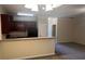 View of open-concept living space with kitchen bar, cabinets, and appliances at 7055 Blairs View Dr # 1, Austell, GA 30168