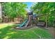 Backyard featuring a wood playset, swing, and slide, great for Gathering fun at 931 Windsor Creek Dr, Grayson, GA 30017