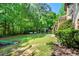 Spacious backyard with green grass, gazebo, and playground, offering versatile outdoor living at 931 Windsor Creek Dr, Grayson, GA 30017