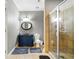 Bathroom features an enclosed shower and vanity with framed mirror at 931 Windsor Creek Dr, Grayson, GA 30017