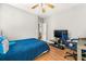 Bedroom featuring a bed, desk, and windows that allow natural light at 931 Windsor Creek Dr, Grayson, GA 30017
