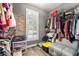 Walk-in closet with ample shelving, bright window, and organization for clothing and accessories at 931 Windsor Creek Dr, Grayson, GA 30017