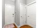 Bright entryway featuring hardwood floors and multiple white doors for an inviting welcome at 931 Windsor Creek Dr, Grayson, GA 30017