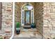 View of the stone entrance and front door with sidelights at 931 Windsor Creek Dr, Grayson, GA 30017