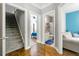 Hallway with stairs and doorways that lead to a bedroom and bathroom at 931 Windsor Creek Dr, Grayson, GA 30017